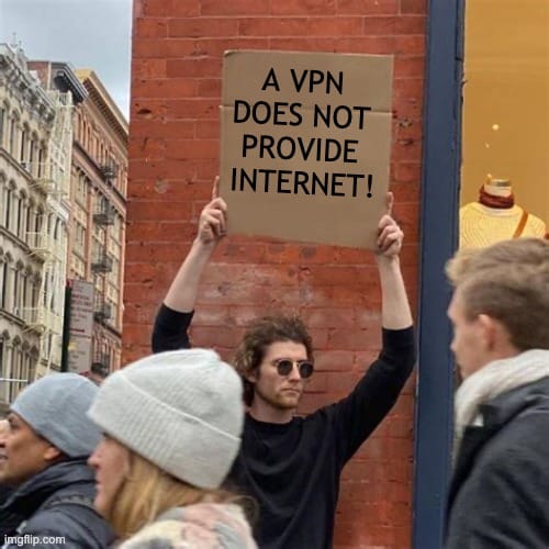 Image of man holding a sign that reads "A VPN does not provide internet"